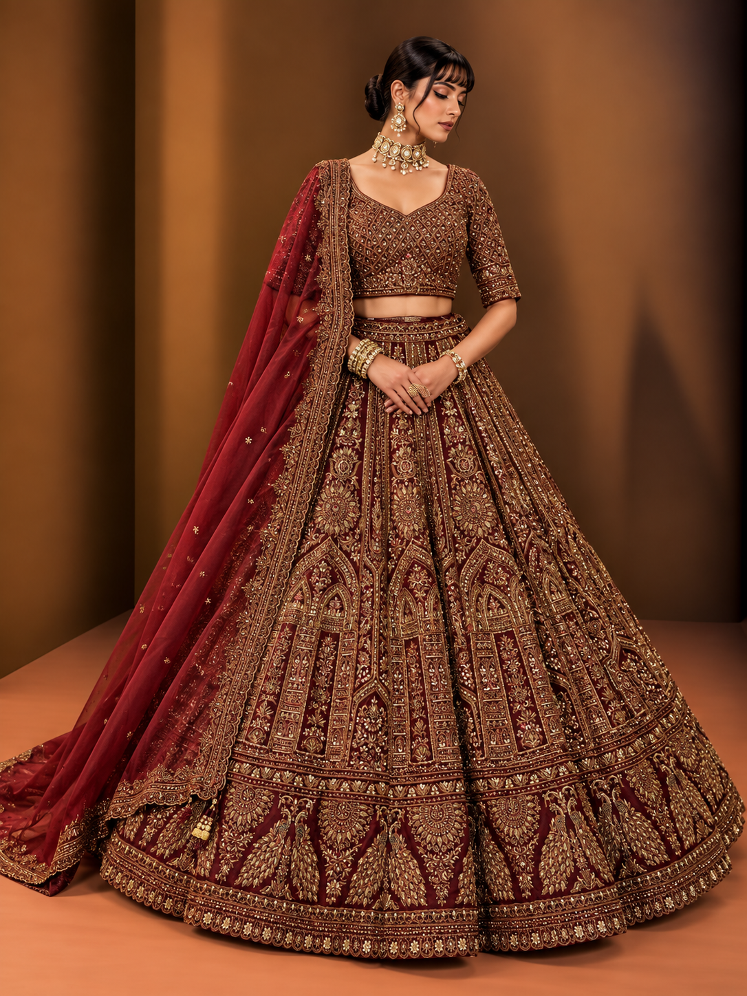 Burgundy and antique gold peacock embroidered bridal lehenga