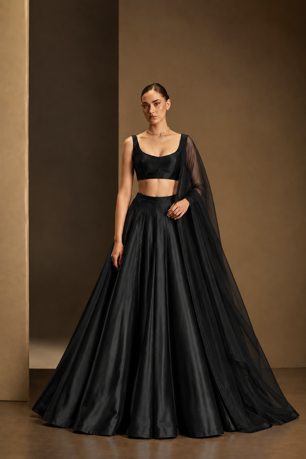 Black plain lehenga with sleeveless choli and matching sheer dupatta
