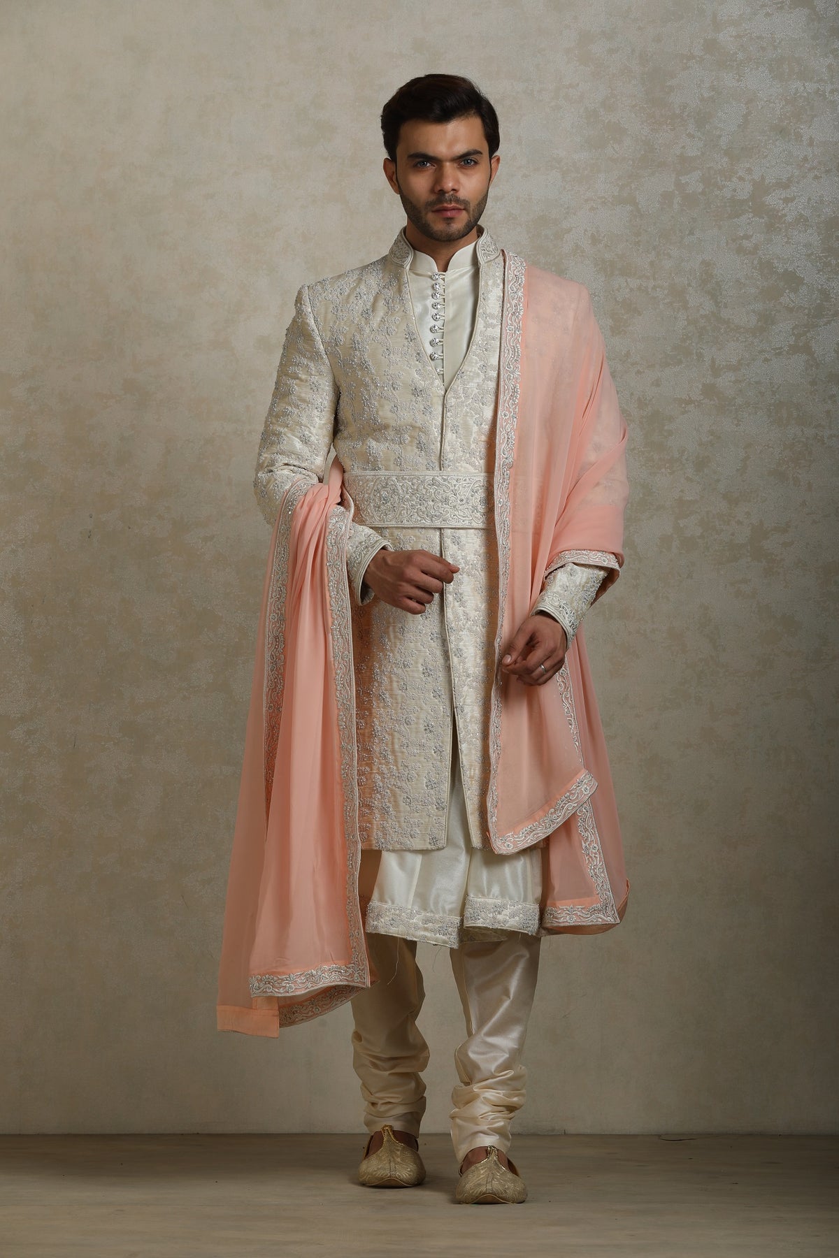 Cream groom sherwani with belt and chola by WellGroomed